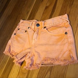 Distressed Orange Free People Denim Shorts